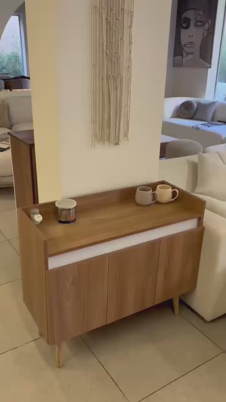 Oslo coffee cabinet with cups on its top in a home setting