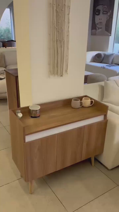 Oslo coffee cabinet with cups on its top in a home setting